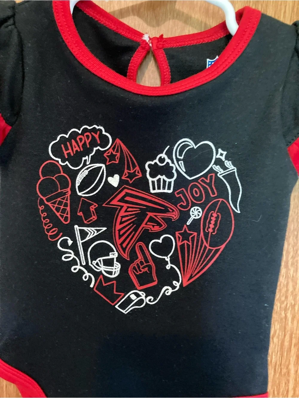 NFL Atlanta Falcons Baby One-Piece with Red Trim and Heart Graphic